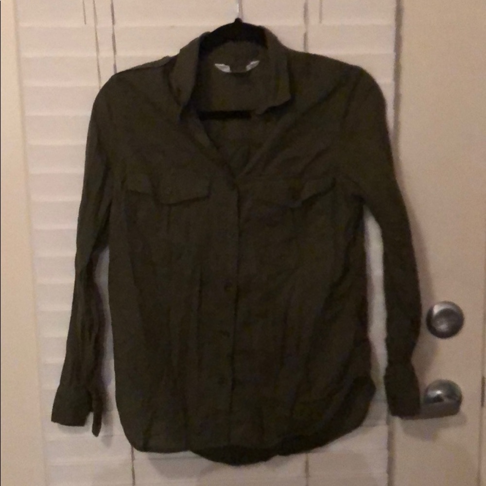 Olive green collared shirt.